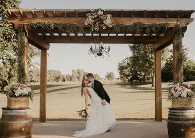 Couple Kiss under Pergola