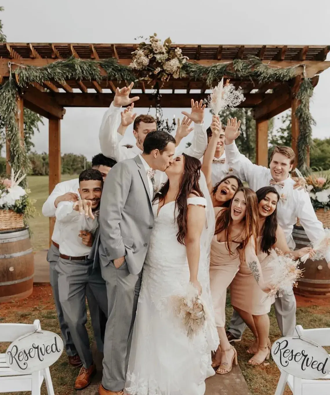 Outdoor Ceremony Space Couple and wedding party celebrating