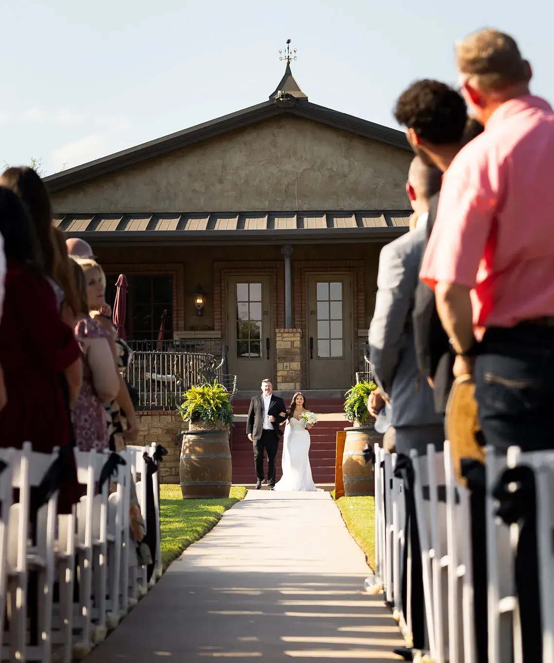 wedding-logistics A bride and her father walking down the aisle