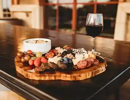Red wine with charcuterie board at a wine tasting in Oklahoma City