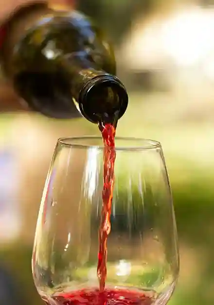 Red wine being poured into a glass